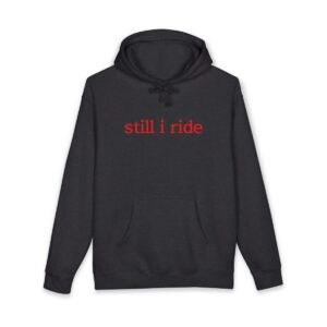 Black hoodie with red 'still i ride' text on front.