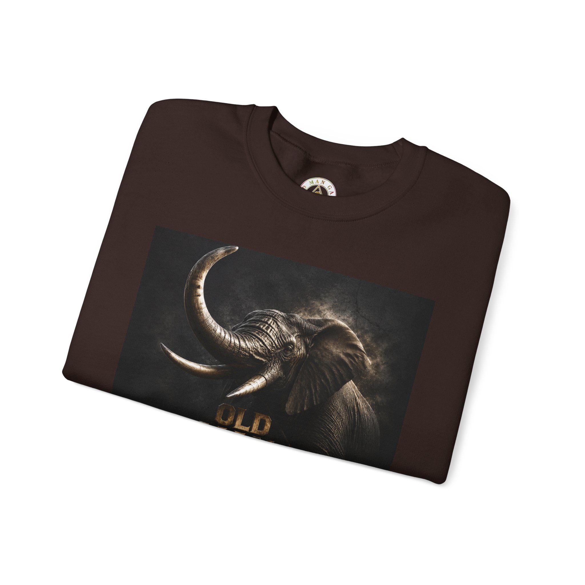 Folded brown tee showing metallic elephant art